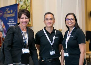 Health Services Authority staff at the conference: From left, CEO Lizzette Yearwood, Dr. John Lee and Angella Berry.