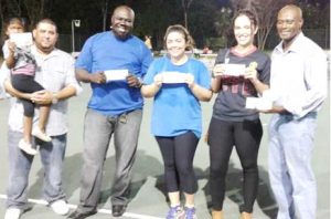 Among the raffle winners are, from left, Bavan Antonysraj, Shane McField, Kristen Miller, Sasha Thompson and NCVO representative Trevor Blake.