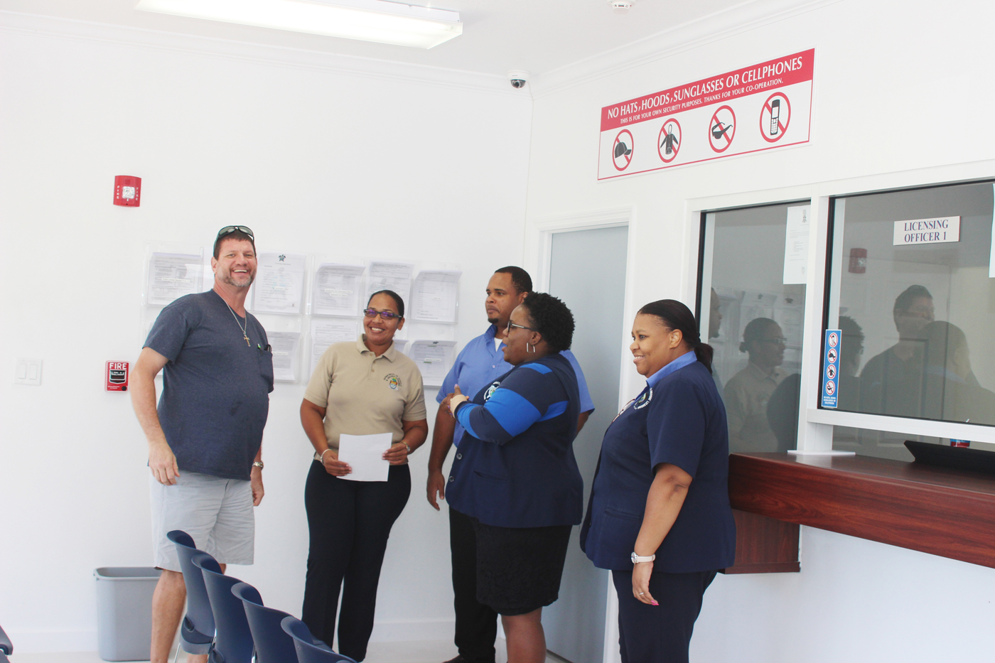 Customer Michael Chapman, left, meets the staff at the licensing department.