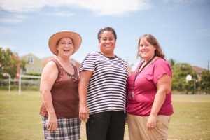 Sandra Turley, English teacher and department chair; Salome Wallace-El, math teacher and department chair; and Rachael Banta, social studies teacher