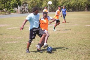 Ken Downey and Simba Gurure fight for the ball.