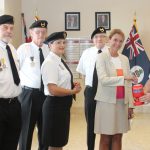 ‘I will wear it with pride’: Veteran pins governor with first poppy