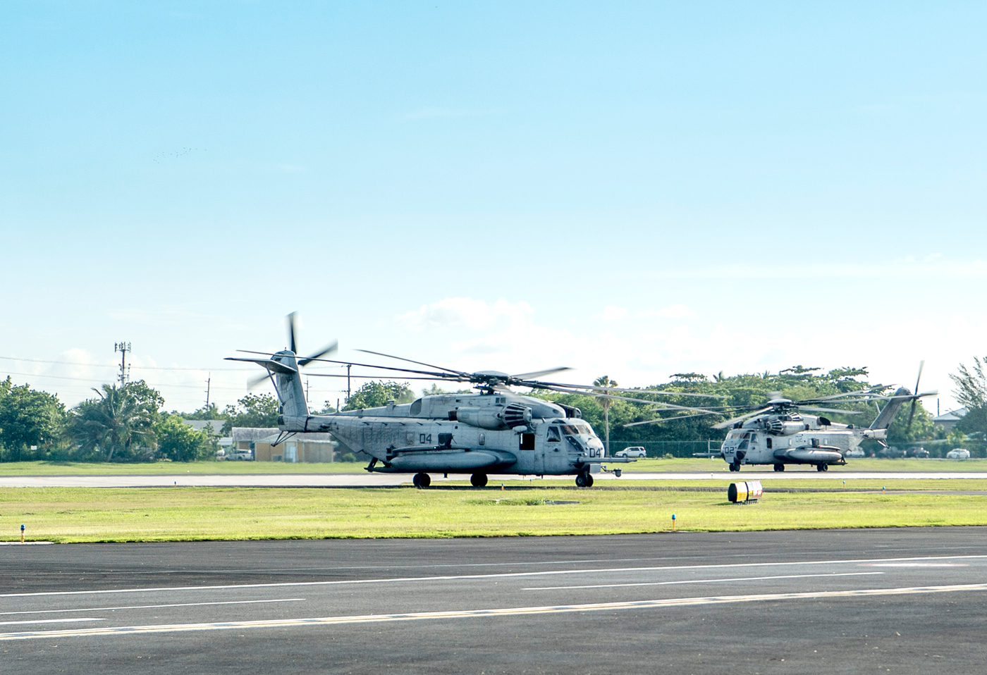 Two Marine Corps CH-53E Super Stallions at Owen Roberts International Airport on Tuesday. The helicopters departed Wednesday, bound for Jamaica, to begin hurricane disaster relief efforts in Haiti. - PHOTO: TANEOS RAMSAY