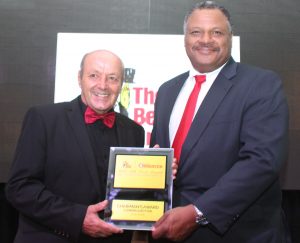 Clemens Guettler, left, receives the Chairman's Award from Danvillle Walker. - Photo: Jewel Levy