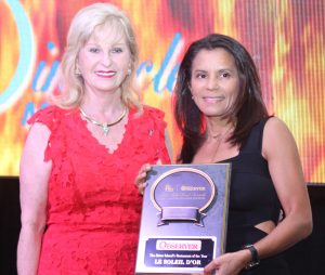 Pinnacle Media co-publisher Vicki Legge presents Nancy Powery on behalf of Le Soleil d’Or with the Sister Islands Restaurant of the Year award. - Photo: Jewel Levy
