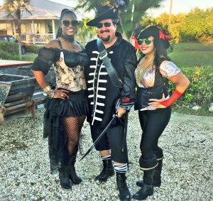 Pirates Week Executive Director Melanie McField, Cayman Distributors Group General Manager Frank Roulstone and Little Cayman Committee Chairwoman Kerry Scott.