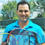 International tennis player coaches primary students