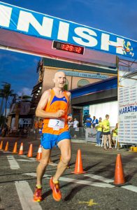 Steve Speirs crosses the halfway mark in Sunday’s marathon. He finished the full marathon in first place with a time of 2 hours, 58 minutes and 48 seconds.
