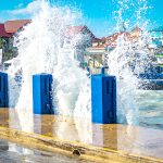 High waves, debris block roads in George Town