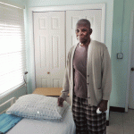 Barbadians donate new bed to Cayman seniors home