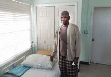 Barbadians donate new bed to Cayman seniors home