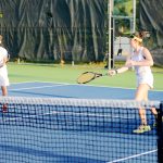 Junior tennis players have a ball