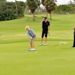 Junior golfers battle poor weather