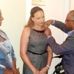 Rotary district governor inducts three Brackers