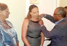 Rotary district governor inducts three Brackers