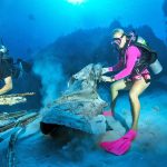 Divers clear debris from Kittiwake dive site