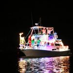 Vessels lit up in Christmas finery strut their stuff