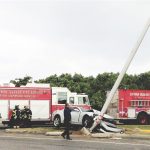 Car smashes into light pole