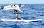 Paddleboarders stand up for cancer victims