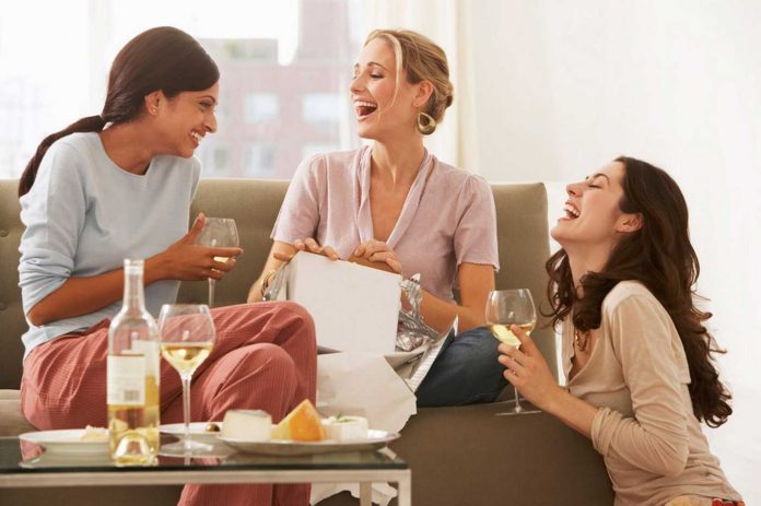 women-drinking-wine-and-laughing-(1)