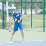 Junior tennis players swing into action