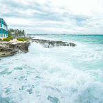 Storm strengthens to hurricane, tracks away from Cayman