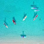 Paddleboarders stand up for cancer survivors