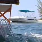 Boating crash victim remains in hospital