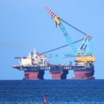Pipe laying vessel dots Cayman’s horizon
