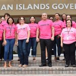 Civil Service to launch anti-bullying strategy Deputy Governor Franz Manderson, centre, and civil servants take part in the Stood Up anti-bullying campaign. - Photo: GIS