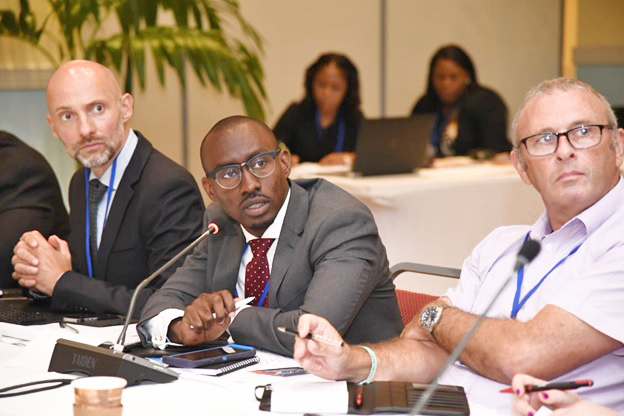 Crown counsel Garcia Kelly (middle) and FCU financial investigat