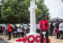 Rain adds to pensive memorial to veterans