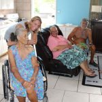 Charity seeks support to help needy Tara Nielsen, of ARK (pictured with a family that the charity supports) is seeking donations to help support those in need.