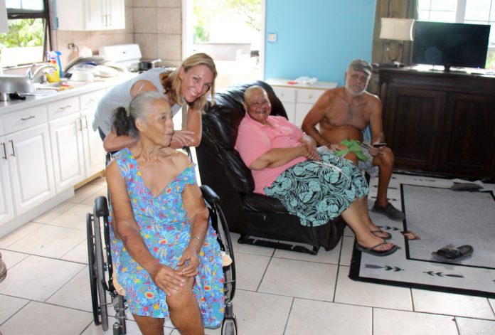 Tara Nielsen, of ARK (pictured with a family that the charity supports) is seeking donations to help support those in need.