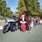 Harley-riding Santa delivers gifts