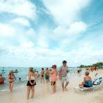 How much tourism is too much for a small island? Tourists on Seven Mile Beach