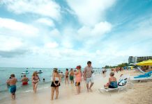 How much tourism is too much for a small island? Tourists on Seven Mile Beach