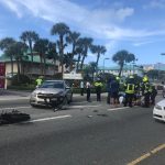 Motorbike and car collide on West Bay Road
