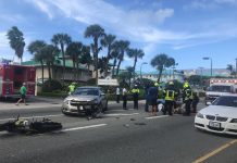 Motorbike and car collide on West Bay Road