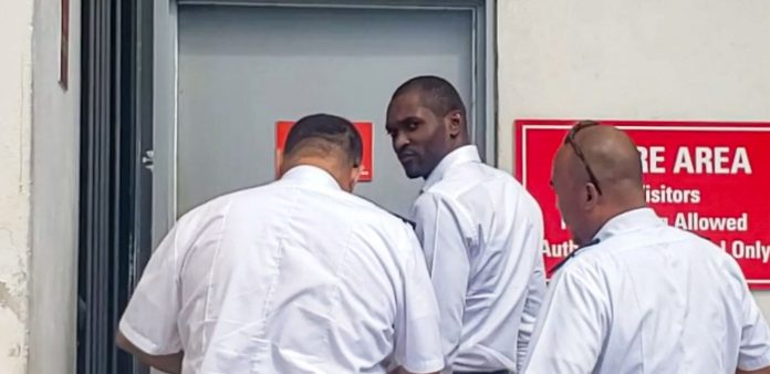 Daniel Meeks is escorted to court cells