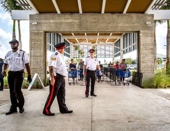 Police were out in force at supermarkets throughout Cayman on Saturday.