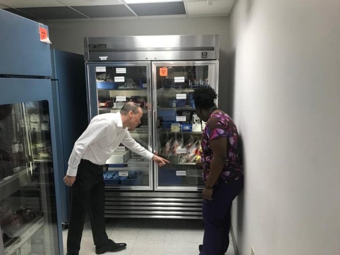 Governor Martyn Roper during a tour of the Health Services Authority laboratory