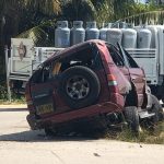 Coroner’s court: Fatal accidents were the result of misadventure The crumpled SUV lies at the side of Rex Crighton Boulevard Friday.