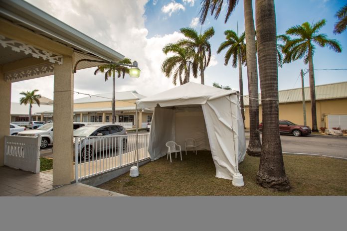 A tent has been set up in Pasadora Place to allow doctors to screen patients with respiratory symptoms.