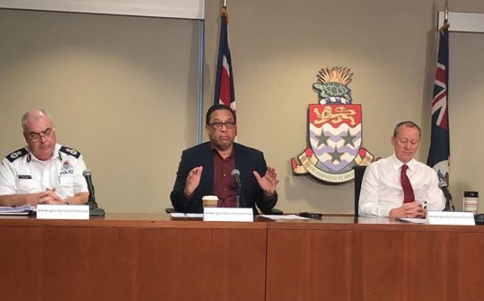 Police Commissioner Derek Byrne, Premier Alden McLaughlin and Governor Martyn Roper at Monday's press briefing at which they announced a 9pm to 5am curfew.