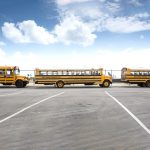 Isolated student taken to hospital Buses line up at the airport to take returning students to isolation units