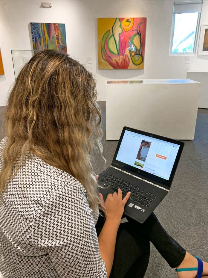 Lauren Anderton, NGCI senior arts administrator, tests the virtual tour of the Bendel Hydes exhibition.