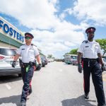 High-visibility patrols as Cayman prepares for lockdown Police on high visibility patrol outside Fosters supermarket in George Town