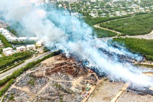 Smoke wafts across the Esterley Tibbetts Highway towards Lakeside Apartments during this week's landfill fire