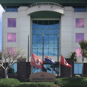 Flags fly at half-staff outside Queensgate House